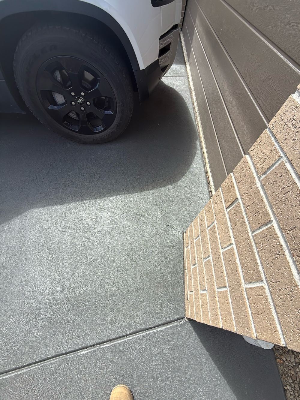 Minor surface cracking across the concrete driveway, recorded for monitoring, found during a pre-purchase building and pest inspection in Doreen