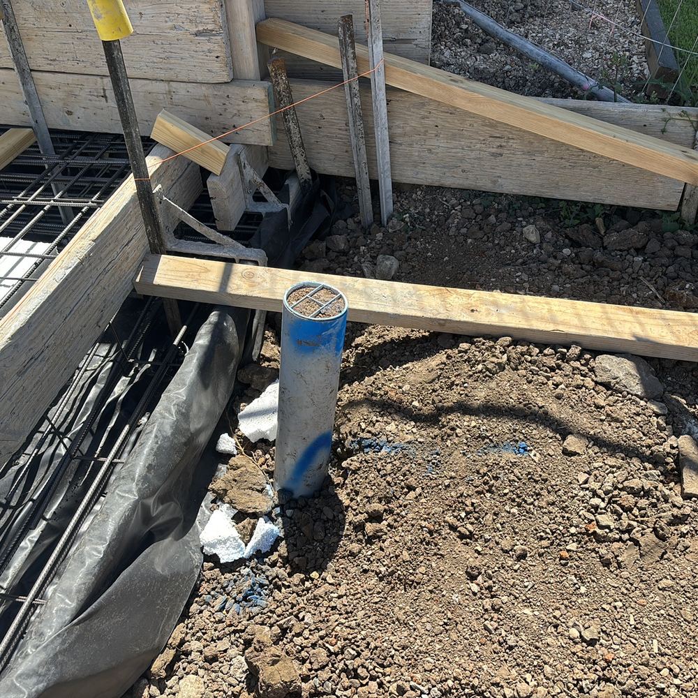 Broken stormwater or sewer pipe sitting in the slab area before the pour, Beveridge